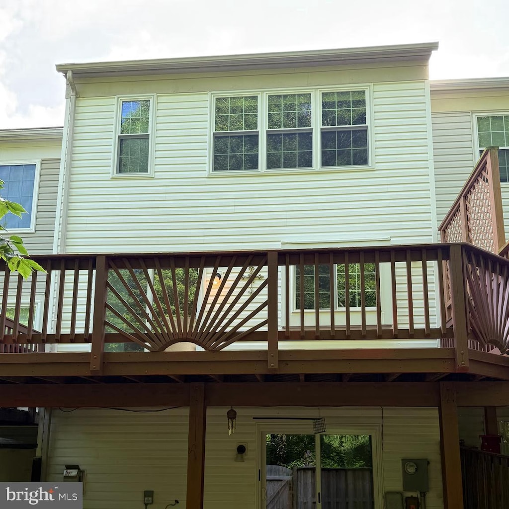 back of house featuring a wooden deck