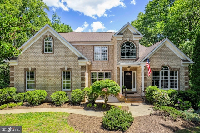 view of front of home with brick siding