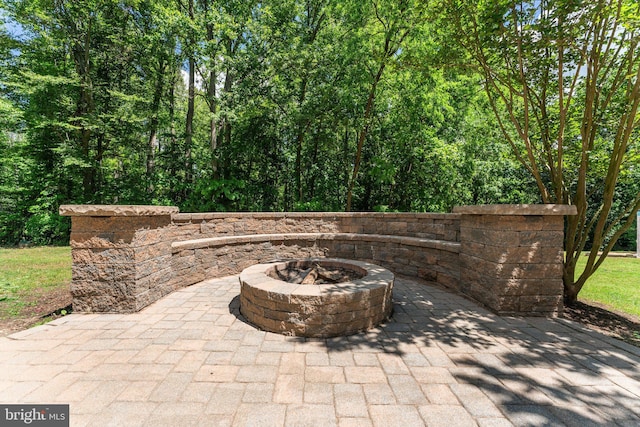 view of patio / terrace featuring an outdoor fire pit