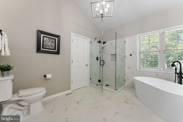 full bathroom with toilet, a marble finish shower, a freestanding bath, a chandelier, and marble look tile flooring