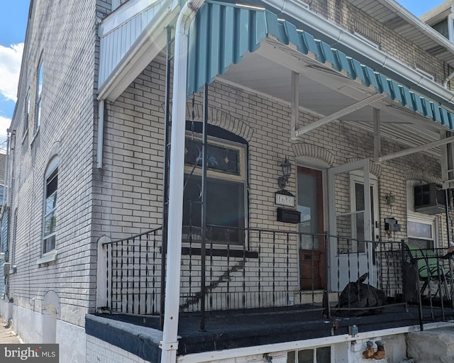view of property exterior with brick siding