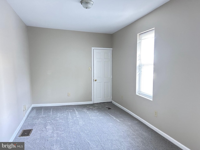 520 Birch St, Reading, PA 19604 - spare room featuring healthy amount of natural light, carpet flooring, and baseboards