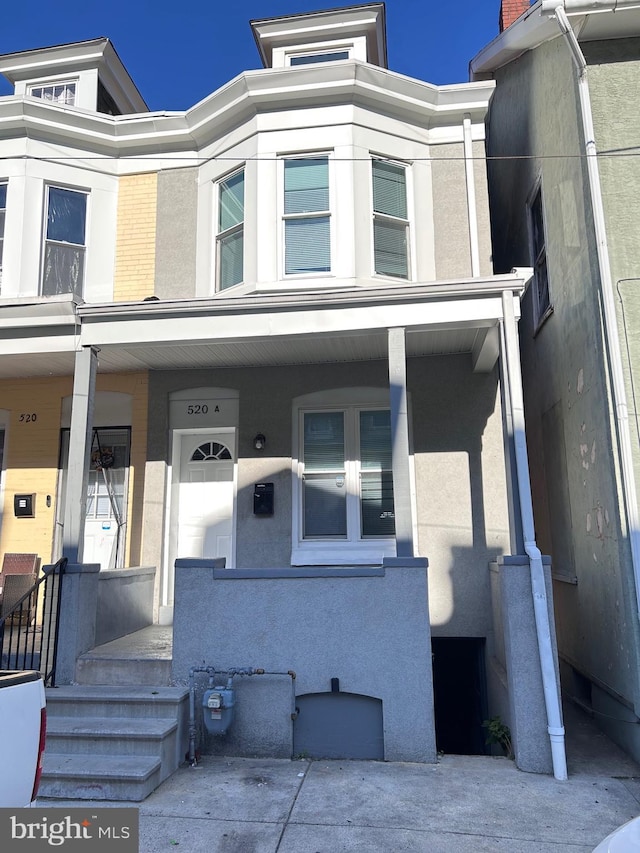 520 Birch St, Reading, PA 19604 - multi unit property featuring a porch and stucco siding