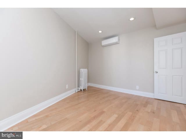 1539 E Berks St, Philadelphia, PA 19125 - unfurnished room featuring radiator, a wall unit AC, light wood-style flooring, baseboards, and recessed lighting