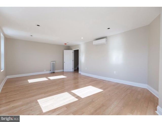 1539 E Berks St, Philadelphia, PA 19125 - unfurnished room featuring radiator, a wall mounted AC, light wood finished floors, baseboards, and recessed lighting