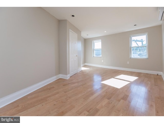 1539 E Berks St, Philadelphia, PA 19125 - spare room with light wood-style flooring, baseboards, a wall unit AC, and recessed lighting