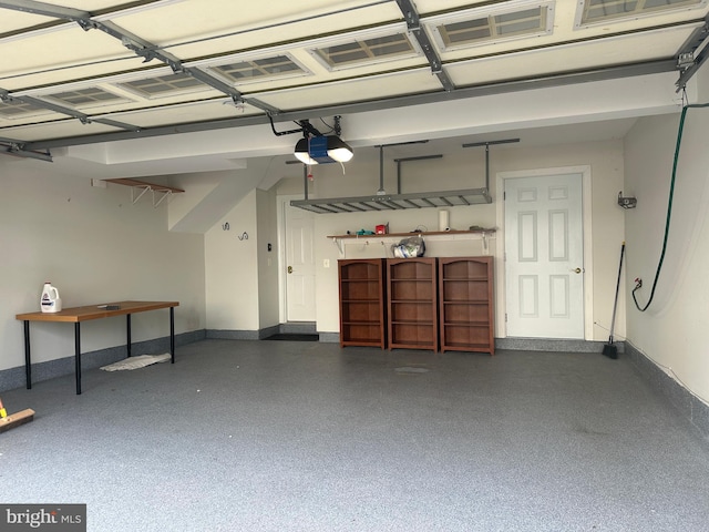 93 Heron Ln, Occoquan, VA 22125 - garage with a garage door opener and baseboards