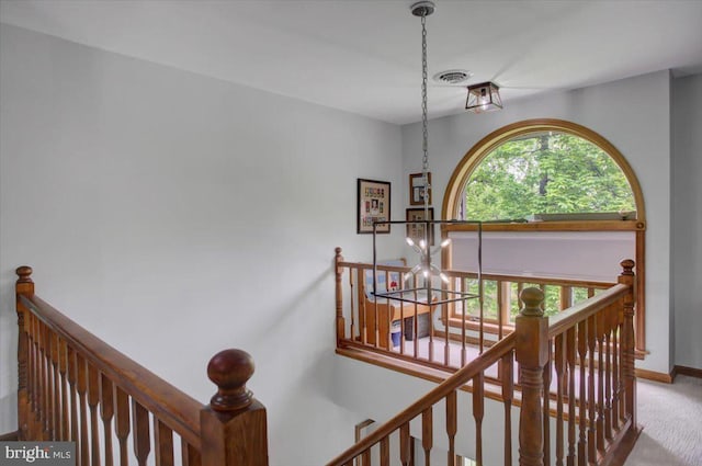 stairway with carpet flooring and baseboards