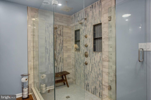 bathroom with a shower stall