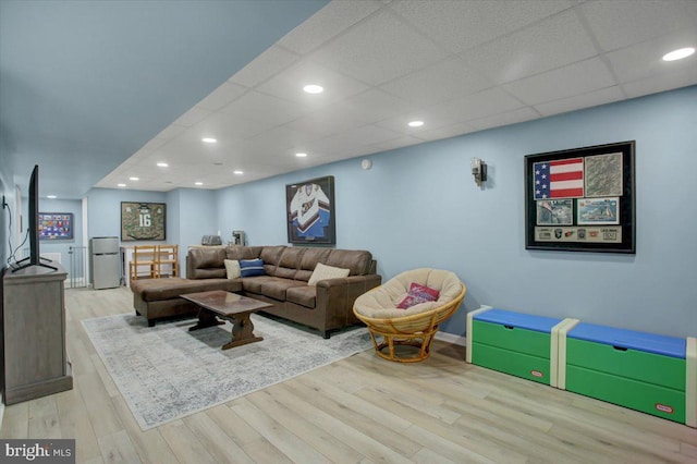 living room with wood finished floors and recessed lighting