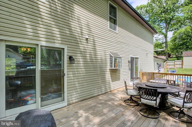 wooden deck with outdoor dining space