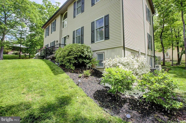 view of side of home featuring a yard