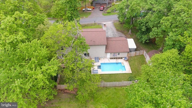 view of subject property featuring a pool area