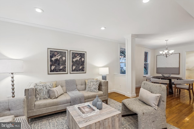104 E Oxford Ave, Alexandria, VA 22301 - living room featuring a chandelier, crown molding, wood finished floors, recessed lighting, and baseboards