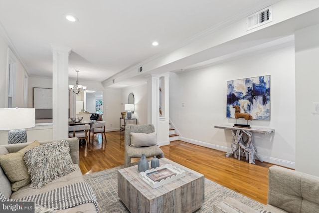 104 E Oxford Ave, Alexandria, VA 22301 - living area featuring ornate columns, wood finished floors, ornamental molding, recessed lighting, and stairway