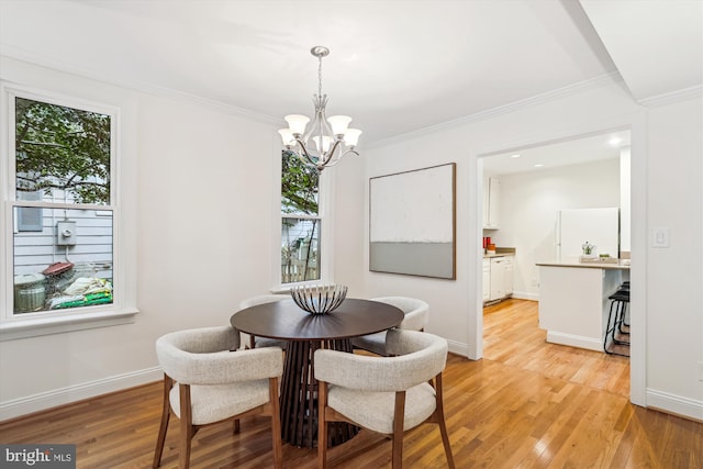 104 E Oxford Ave, Alexandria, VA 22301 - dining area with a chandelier, crown molding, light wood finished floors, and baseboards