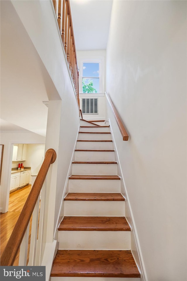 104 E Oxford Ave, Alexandria, VA 22301 - staircase featuring wood finished floors and baseboards