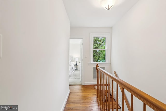 104 E Oxford Ave, Alexandria, VA 22301 - hallway with an upstairs landing, light wood-type flooring, and baseboards
