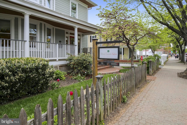 104 E Oxford Ave, Alexandria, VA 22301 - property entrance featuring covered porch and fence