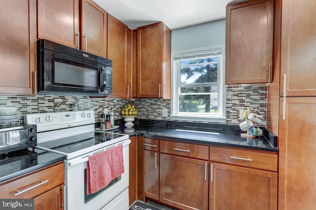 1811 Halifax Rd, Woodbridge, VA 22191 - kitchen with electric range, black microwave, decorative backsplash, dark stone counters, and brown cabinets