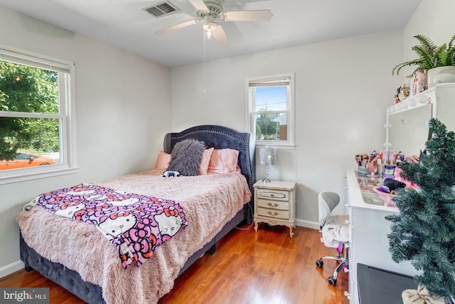 1811 Halifax Rd, Woodbridge, VA 22191 - bedroom with multiple windows, wood finished floors, and baseboards
