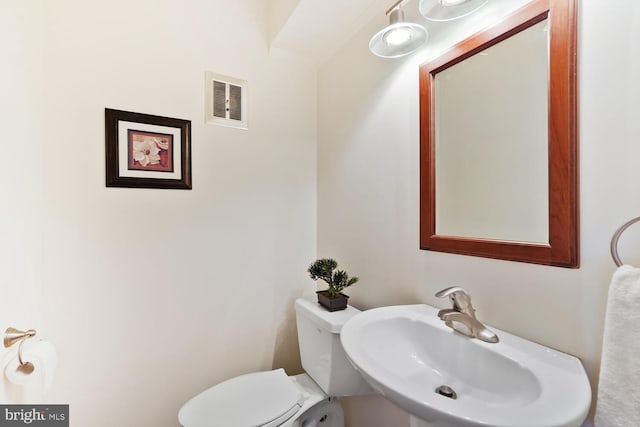 bathroom with a sink and toilet