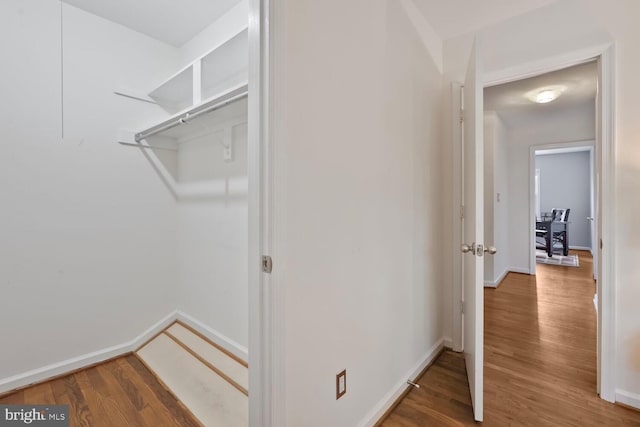 spacious closet with wood finished floors