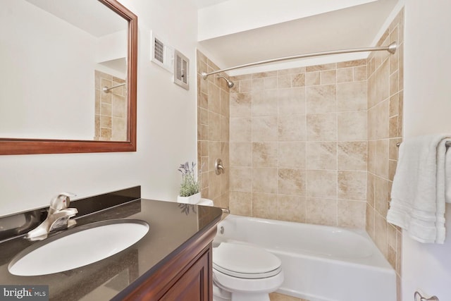 full bath featuring  shower combination, vanity, and toilet