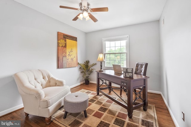 office with a ceiling fan, baseboards, and wood finished floors