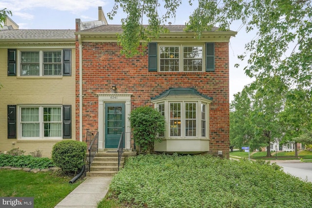 view of front of home featuring brick siding