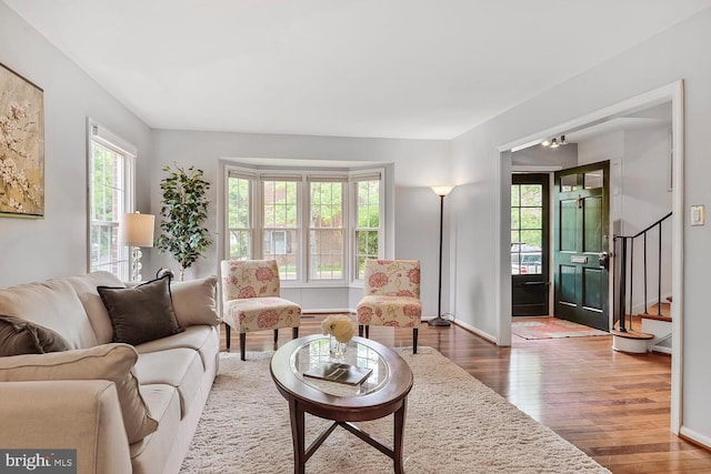 living area featuring wood finished floors and baseboards