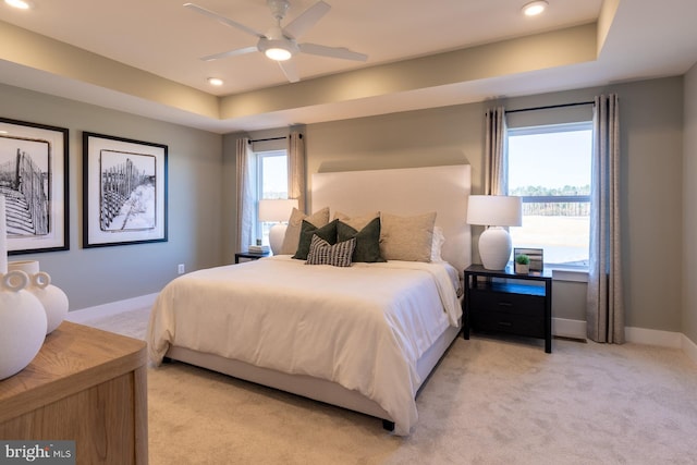 389 Scranton Ln, Ocean View, DE 19970 - bedroom with light carpet, recessed lighting, baseboards, a raised ceiling, and ceiling fan