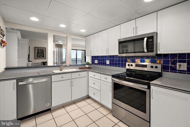 11000 Coastal Hwy Unit 1211, Ocean City, MD 21842 - kitchen featuring stainless steel appliances, a sink, white cabinetry, recessed lighting, and dark countertops