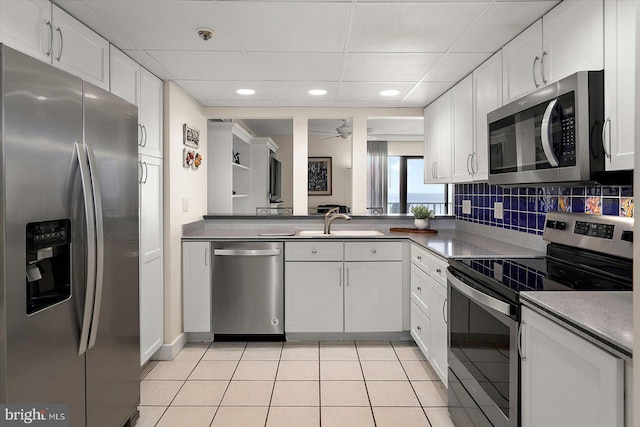 11000 Coastal Hwy Unit 1211, Ocean City, MD 21842 - kitchen with stainless steel appliances, white cabinetry, a sink, light tile patterned floors, and recessed lighting