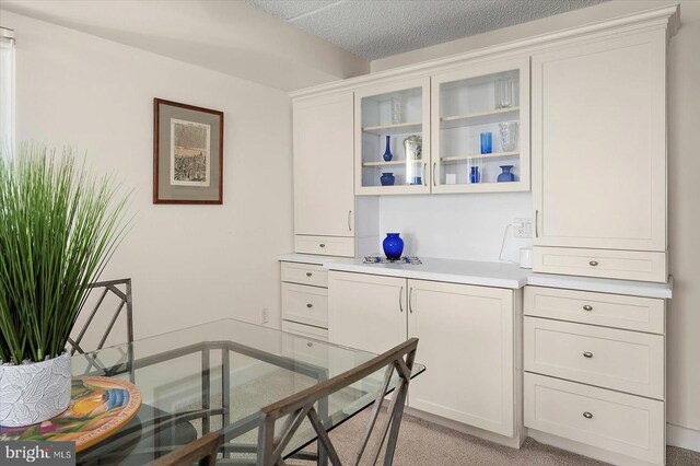 11000 Coastal Hwy Unit 1211, Ocean City, MD 21842 - dining area with light carpet and a textured ceiling