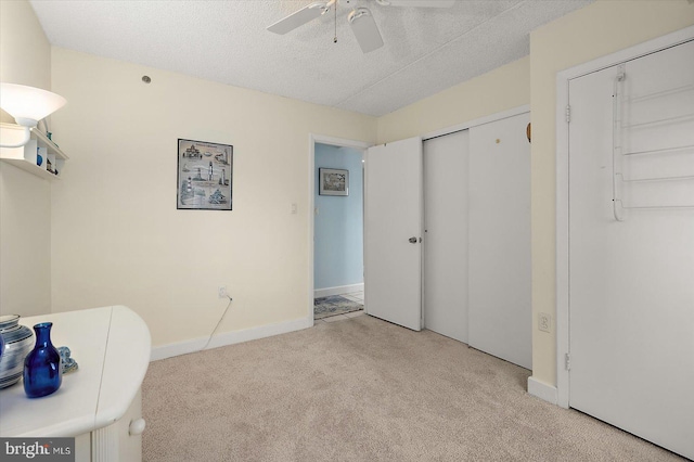11000 Coastal Hwy Unit 1211, Ocean City, MD 21842 - carpeted bedroom with a textured ceiling, baseboards, a ceiling fan, and a closet