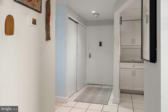11000 Coastal Hwy Unit 1211, Ocean City, MD 21842 - hall featuring light tile patterned floors, recessed lighting, and baseboards
