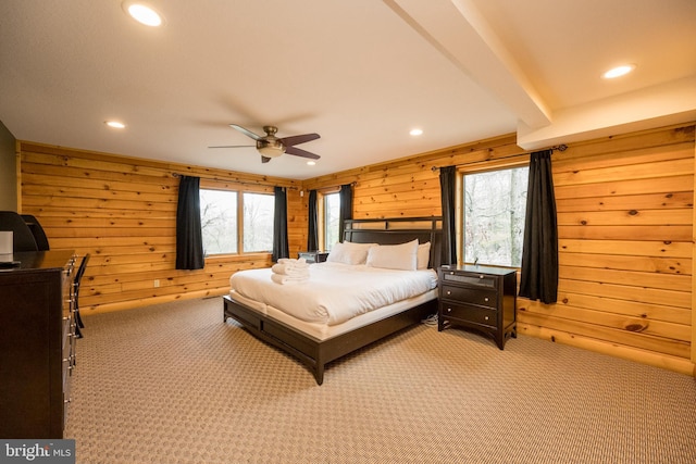 bedroom featuring wooden walls, light colored carpet, recessed lighting, and ceiling fan
