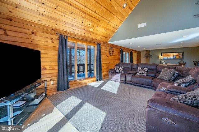 living area with wood finished floors, wooden walls, high vaulted ceiling, and recessed lighting
