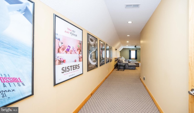 hallway with carpet, recessed lighting, and baseboards