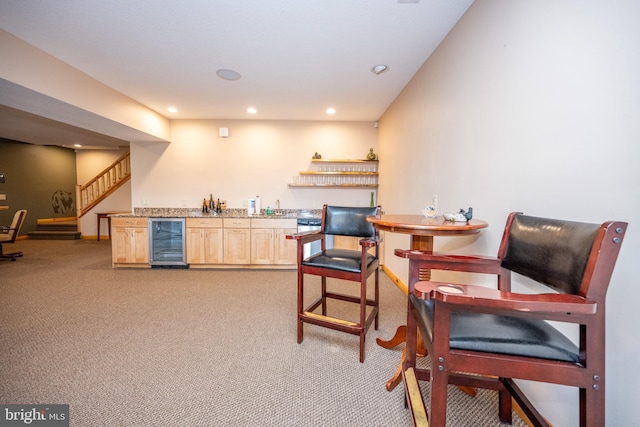 indoor wet bar with beverage cooler, light carpet, recessed lighting, and stairs