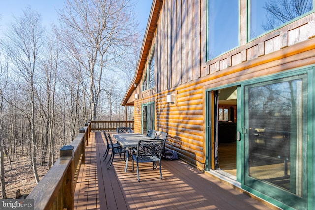 deck with outdoor dining area