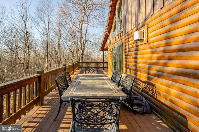 wooden deck with outdoor dining area