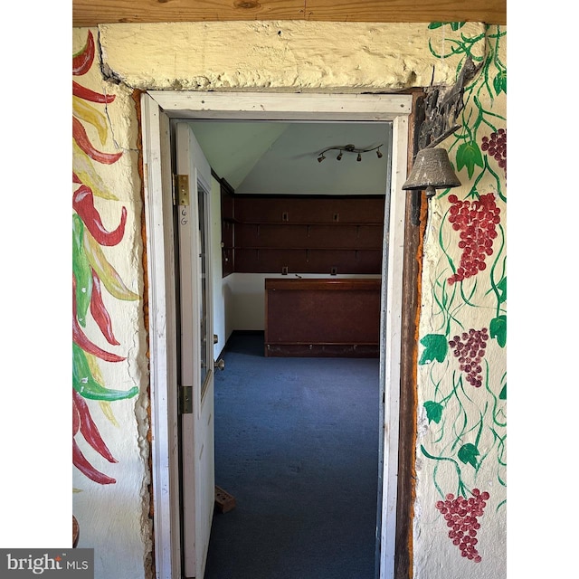 hallway featuring carpet
