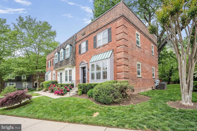 6630 Hillandale Rd Unit 56, Chevy Chase, MD 20815 - view of front of property featuring brick siding, cooling unit, a front lawn, and mansard roof