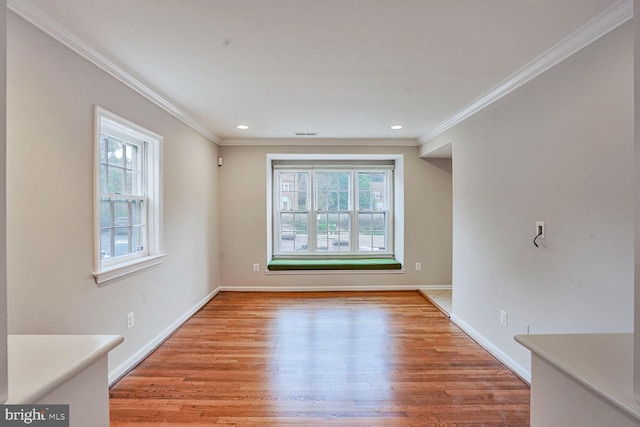 6630 Hillandale Rd Unit 56, Chevy Chase, MD 20815 - unfurnished living room featuring healthy amount of natural light, crown molding, light wood finished floors, baseboards, and recessed lighting