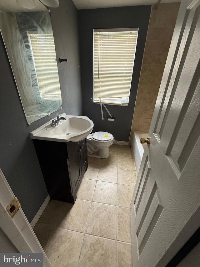 2503 Kent Town Pl Unit 2503B, Hyattsville, MD 20785 - full bathroom with vanity, toilet, baseboards, tile patterned floors, and a bath
