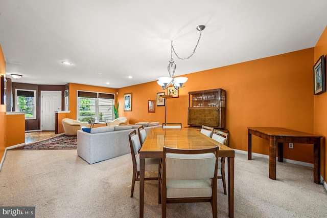 dining space with baseboards, recessed lighting, a chandelier, and carpet flooring