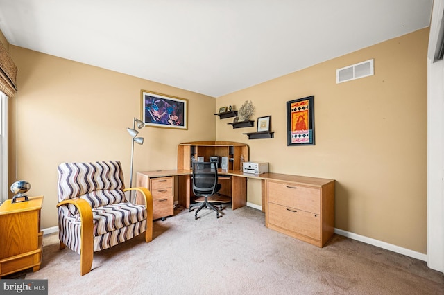 home office with light carpet and baseboards