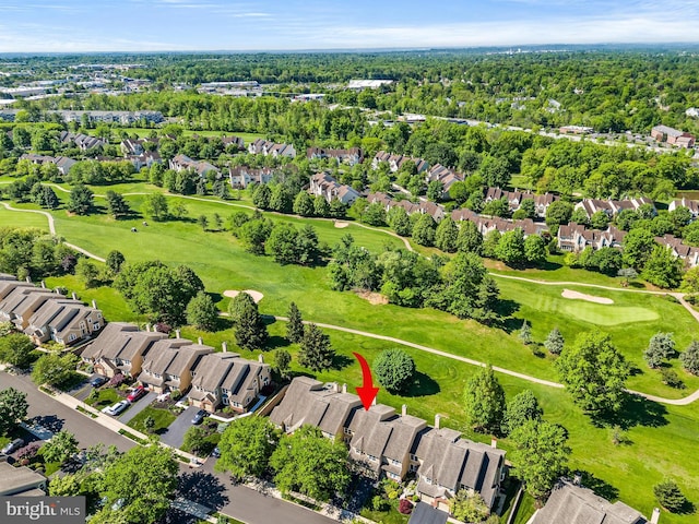 aerial view of residential area featuring a golf course